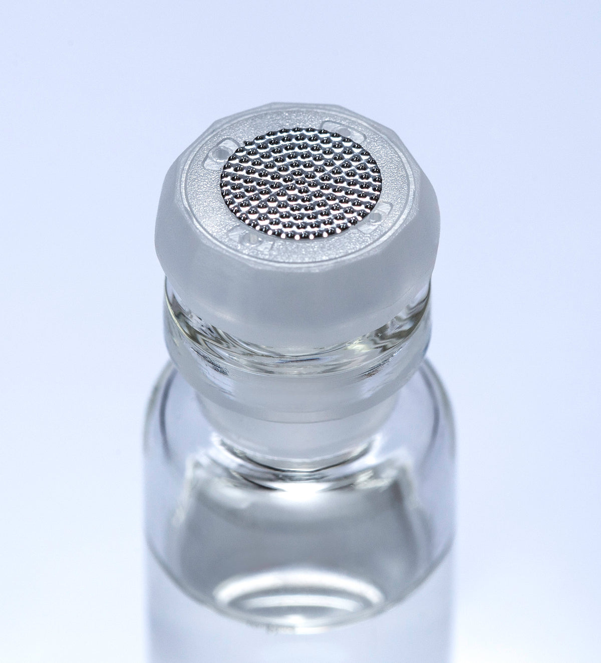 Close-up of a fixed tip, 316 stainless steel contact points on the glass vial